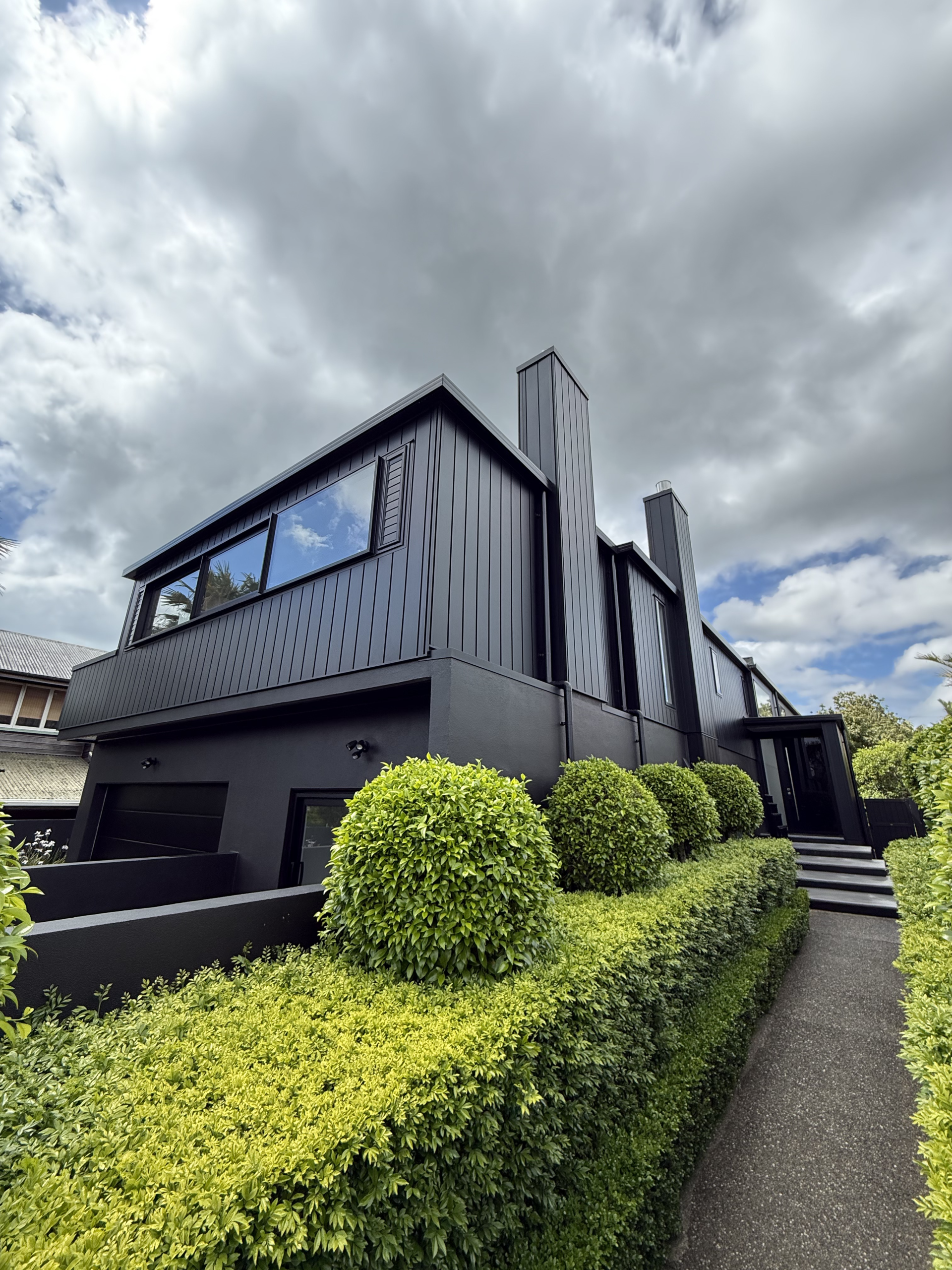 Black Auckland home exterior after professional house washing