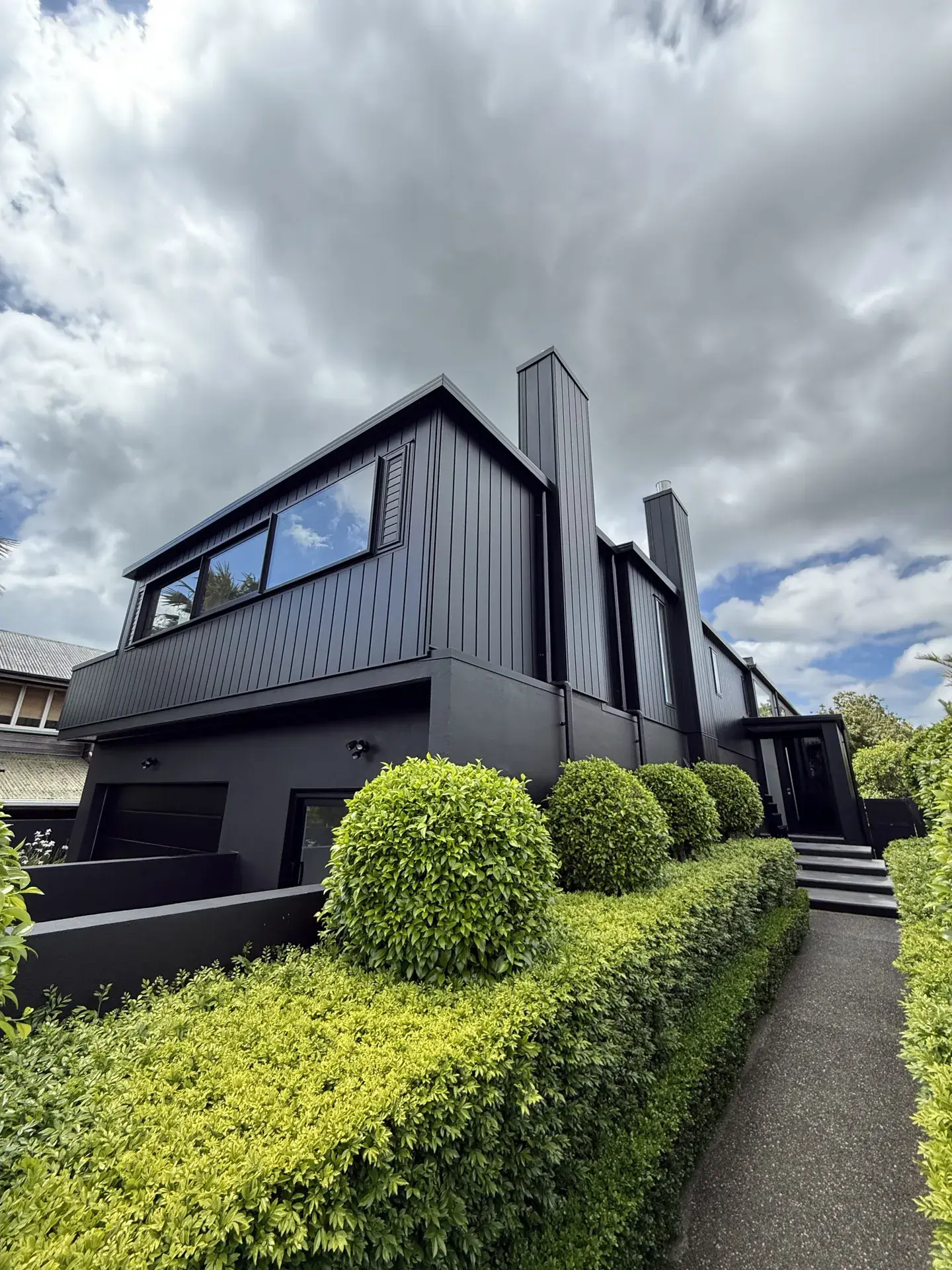 Black Auckland home exterior after professional house washing